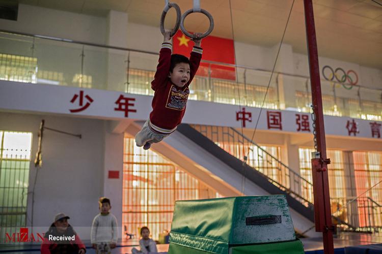 تصاویر مدرسه ژیمناستیک کودکان در چین,عکس های کودکان ژیمناستیک کار چین,تصاویر تمرین کودکان ژیمناستیک کار چینی