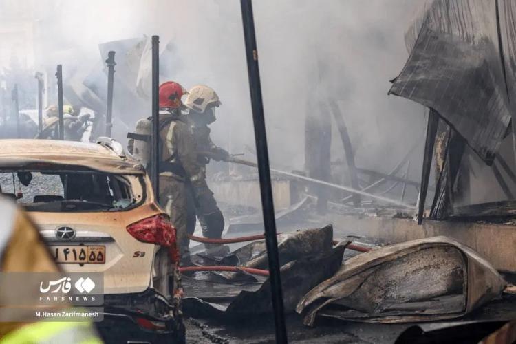 تصاویر آتش‌سوزی بازارچه جنت‌آباد تهران,عکس های آتش‌سوزی بازارچه جنت‌آباد تهران در 14 بهمن 1404,تصاویری از آتش گرفتن بازار جنت در تهران