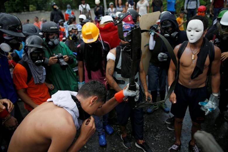 عکس های اعتراض‌های خیابانی مردم ونزوئلا در کاراکاس,تصاویر اعتراض‌های خیابانی مردم ونزوئلا در کاراکاس,عکس های تظاهرات ضد دولتی در ونزوئلا