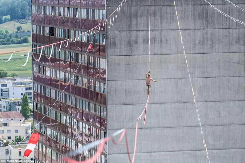 تصاویربندبازی,تصاویربندبازی درشهرزوریخ ,تصاویر بندبازی هیجان‌انگیز در ارتفاع 110 متری شهر زوریخ