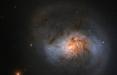 کهکشان مارپیچی با غبارهای قرمز رنگ,اخبار علمی,خبرهای علمی,نجوم و فضا
