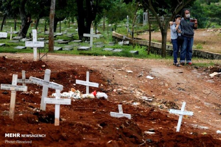 تصاویر دفن قربانیان کرونا در نقاط مختلف جهان,عکس های دفن قربانیان کرونا در نقاط مختلف جهان, تصاویر قربانیان کرونا